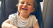 Lou a rejoint le concours — aidez-le/la à gagner de superbes lots ! toddler, child, smiling, stroller, plush_toy, indoor, happy, cute, person, clothing, baby, portrait, seat, hair_tie, toy, young_child, sitting, casual, playful, infant