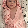 Lou participe au concours pour gagner de l'argent avec cette photo : adorable, baby, blanket, child, curious, cushion, cute, face, foot, hooded_towel, indoors, infant, lying_down, newborn, person, pink_towel, skin, soft_fabric, star_pattern, wrapped