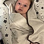 baby, bath_time, blanket, child, cozy, curious, cute, eyes, face, feet, hooded_towel, indoor, infant, lying_down, newborn, person, soft_texture, star_pattern, towel, wrapped