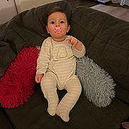 Lou Fievet participe au concours pour gagner de l'argent avec cette photo : baby, child, clothing, comfort, couch, cozy, cute, expression, furniture, home, indoor, infant, pacifier, pillows, plush, portrait, relax, seated, soft, wearing