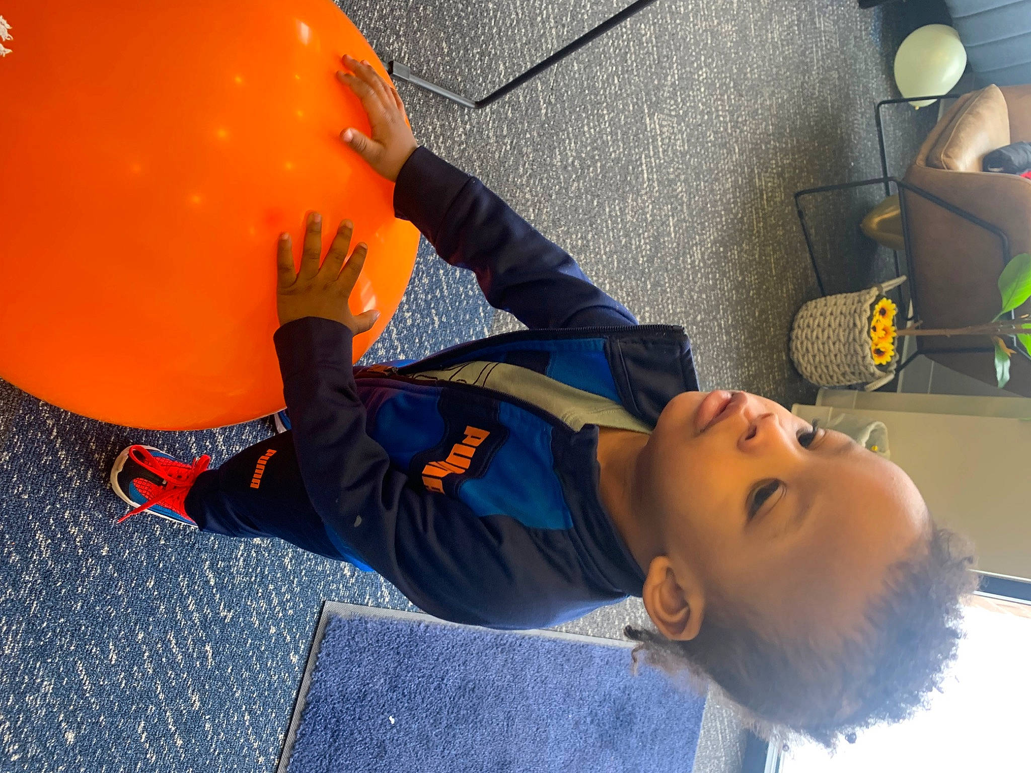 Kameron joined the competition — help win amazing prizes! automotive_design, ball, chair, child, electric_blue, eyewear, family_car, flooring, fun, leisure, party_supply, person, personal_protective_equipment, recreation, room, sphere, toddler, vehicle_door, yellow