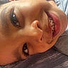 Mateo is registered to the contest to win money with this photo: child, close_up, smile, face, teeth, eye, eyelashes, skin, nose, mouth, casual, joyful, portrait, indoor, young, happy, expression, head, person, cozy