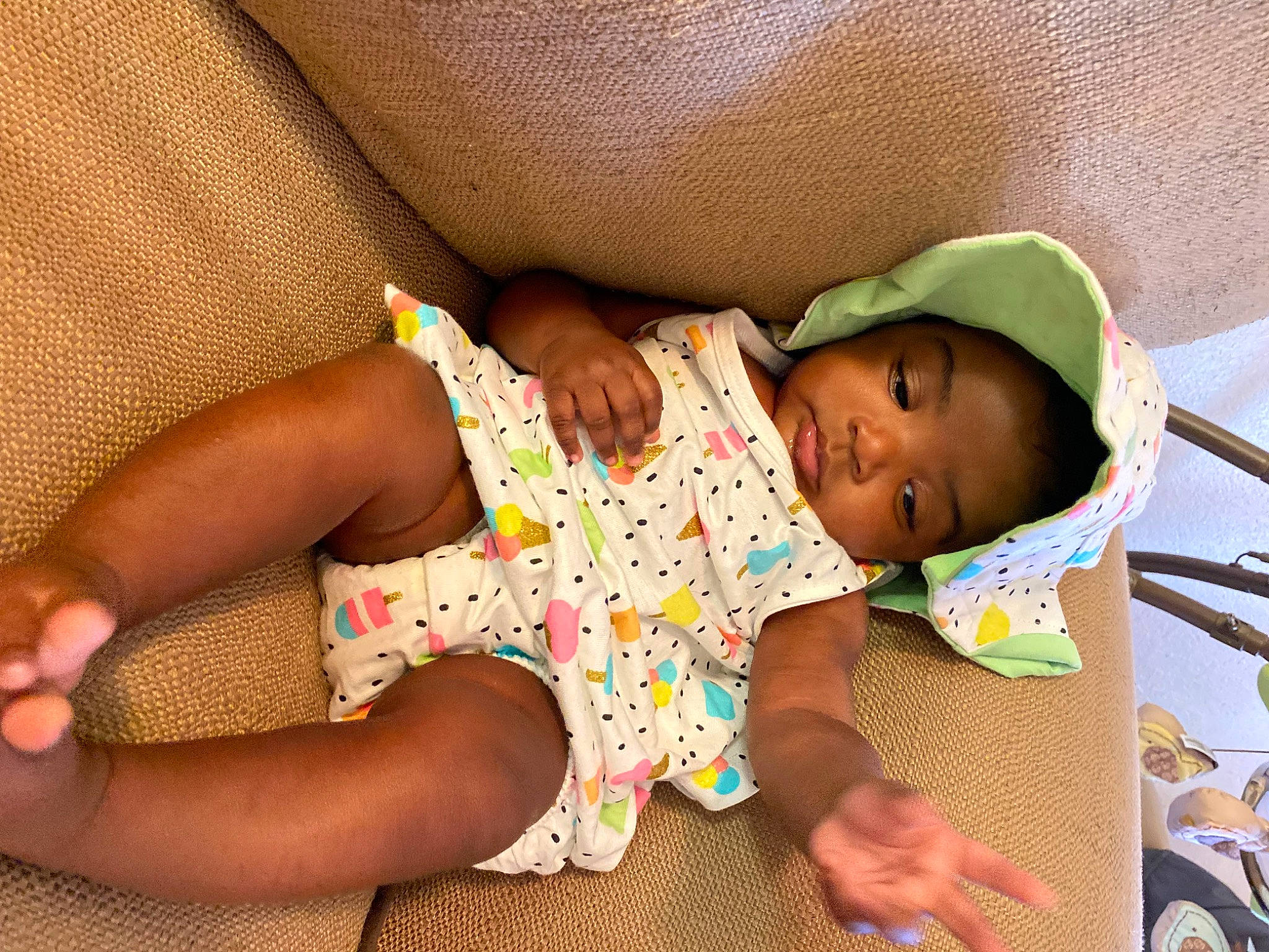 Emonie Campbell is registered to the contest to win money with this photo: baby, baby_toddler_clothing, child, comfort, finger, foot, glasses, hand, happy, human_body, human_leg, knee, leg, linens, nail, pattern, person, skin, textile, thigh