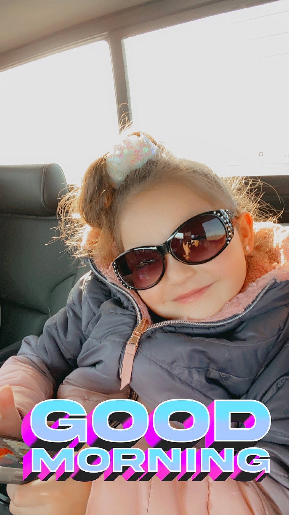Kenzlie joined the competition — help win amazing prizes! automotive_exterior, blond, car_seat, child, comfort, cool, eyewear, font, fun, glasses, goggles, happy, head_restraint, joy, person, personal_protective_equipment, photo_caption, sunglasses, toddler, travel