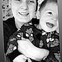 adult, child, smiling, black_and_white, selfie, happy, holding, spiderman, clothing, face, portrait, indoor, person, joyful, patterned_wallpaper, casual, toddler, cute, family, together