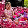 Isabella is registered to the contest to win money with this photo: baby, child, cute, fun, grass, happy, inflatable_pool, orange, outdoor, person, pink, plastic_balls, playtime, purple, smiling, summer, sunlight, toy, white, yellow