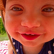 Jocelyn is registered to the contest to win money with this photo: toddler, child, face, smile, hat, straw_hat, polka_dot, clothing, outdoor, sunlight, closeup, happy, cute, skin, cheeks, eyes, mouth, baby, summer, blanket