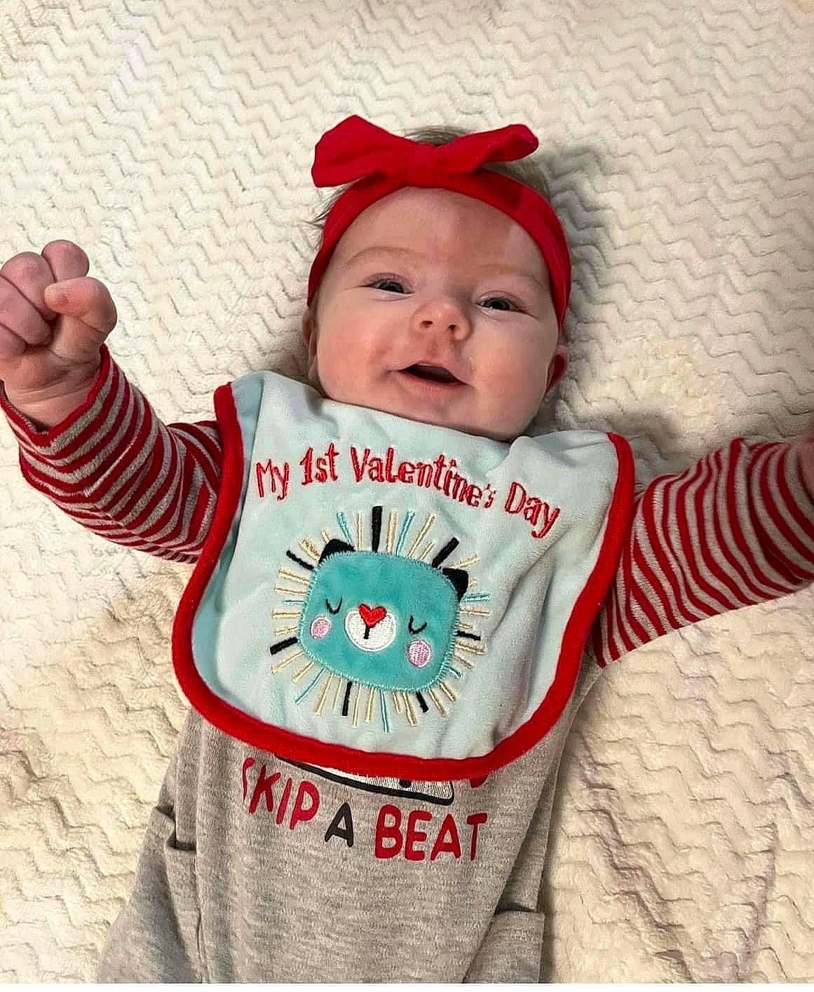 Lucy joined the competition — help win amazing prizes! baby, baby_products, baby_toddler_clothing, cap, carmine, child, costume_hat, fictional_character, font, happy, headwear, linens, long_sleeved_t_shirt, outerwear, pattern, person, sleeve, smile, t_shirt, textile