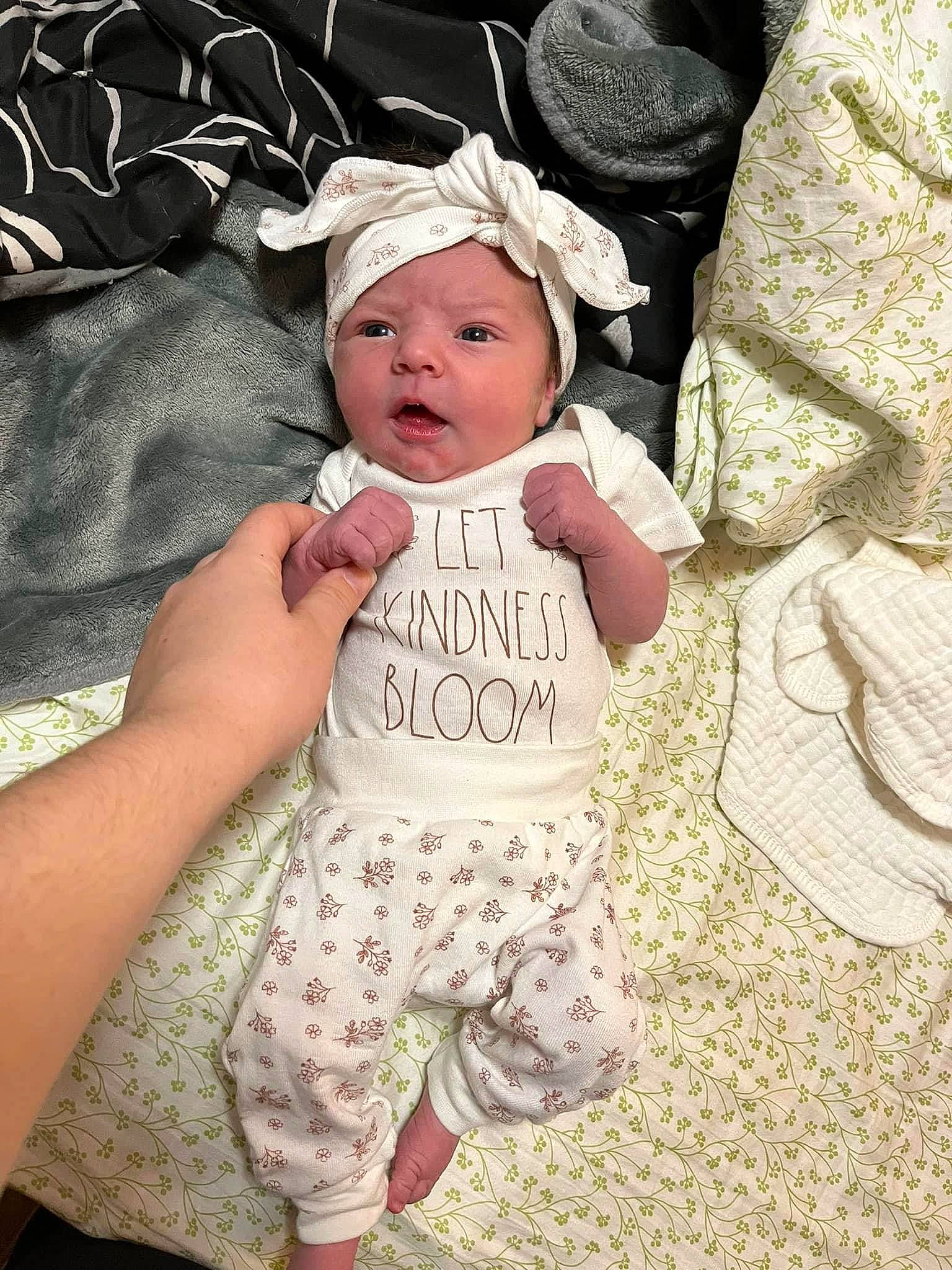 Lucy joined the competition — help win amazing prizes! baby, baby_products, baby_sleeping, baby_toddler_clothing, cap, child, fashion_accessory, finger, grass, hair_accessory, happy, hat, headgear, headwear, linens, pattern, person, sitting, sleeve, t_shirt