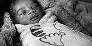 Damian joined the competition — help win amazing prizes! baby, sleeping, blanket, cozy, wrapped, infant, soft, black_and_white, portrait, peaceful, cute, child, resting, closeup, face, newborn, warm, texture, comfort, relaxation