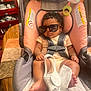 Icelyn is registered to the contest to win money with this photo: accessories, baby, clothing, cup, cushion, face, furniture, glasses, head, homedecor, medication, person, photography, pill, portrait, shorts, sleeping, sunglasses, t_shirt, transportation