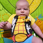 Devin joined the competition — help win amazing prizes! baby, blue, child, colorful_clothing, cute, dragonfly, fabric, green, happy, indoors, infant, onesie, orange, pattern, person, play_mat, smiling, soft, toy, yellow