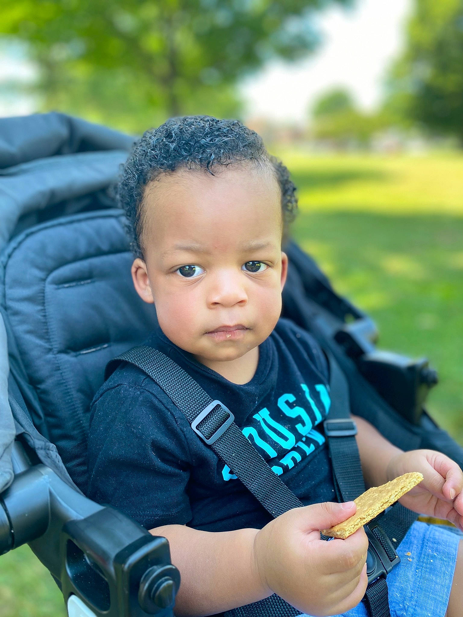 Micah joined the competition — help win amazing prizes! azure, baby, baby_carriage, chair, child, electric_blue, face, fun, grass, hand, happy, leisure, people_in_nature, person, plant, product, recreation, sitting, toddler, tree