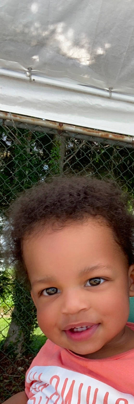 Micah joined the competition — help win amazing prizes! black_hair, cheek, child, eyelash, fence, fun, grass, happy, joy, leisure, mammal, mesh, net, person, toddler, vacation, vertebrate, wire_fencing