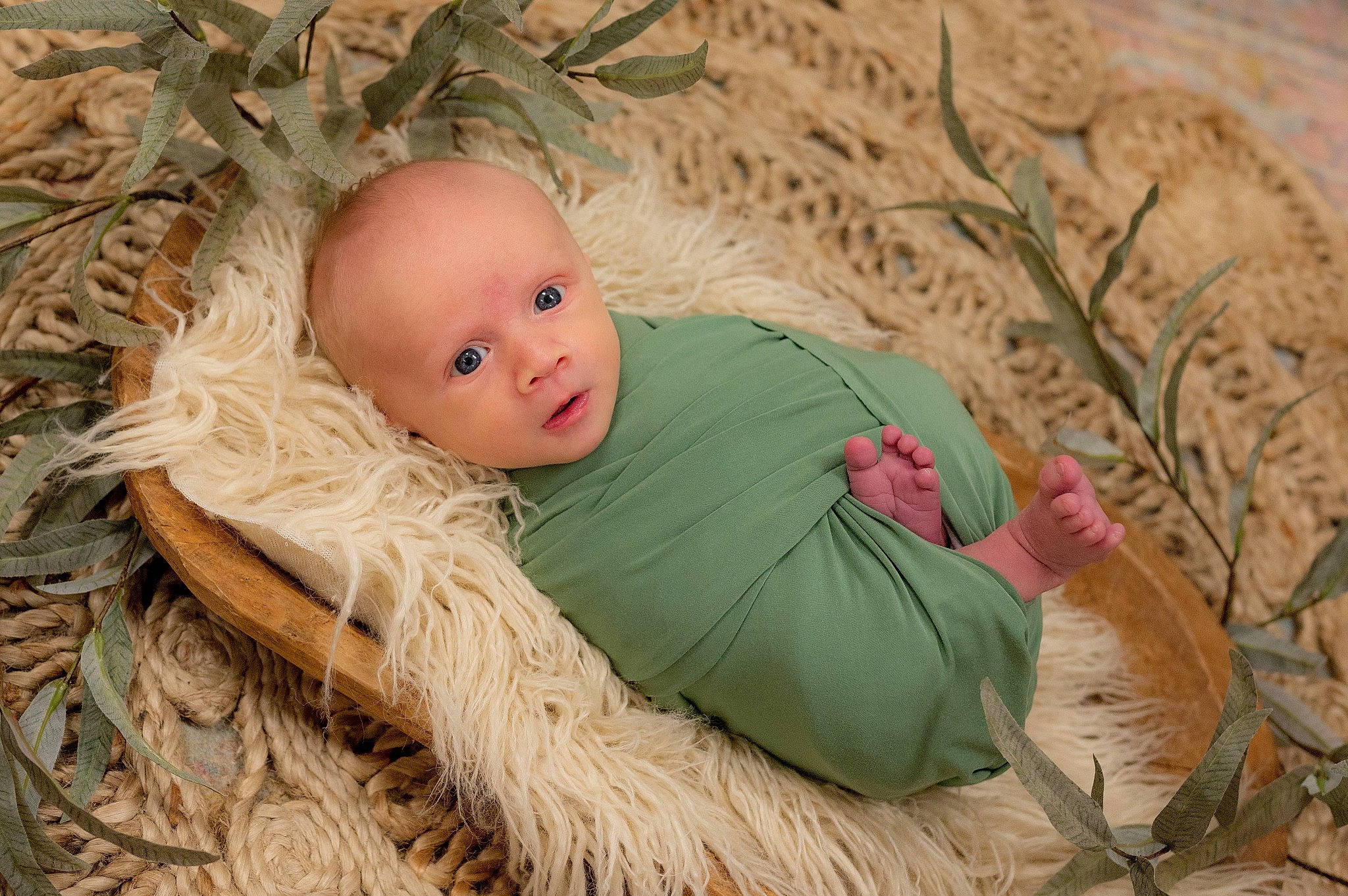Holden is registered to the contest to win money with this photo: baby, child, comfort, doll, eye, fawn, fur, grass, grass_family, happy, headgear, people_in_nature, person, plant, sitting, skin, textile, toy, twig, wood