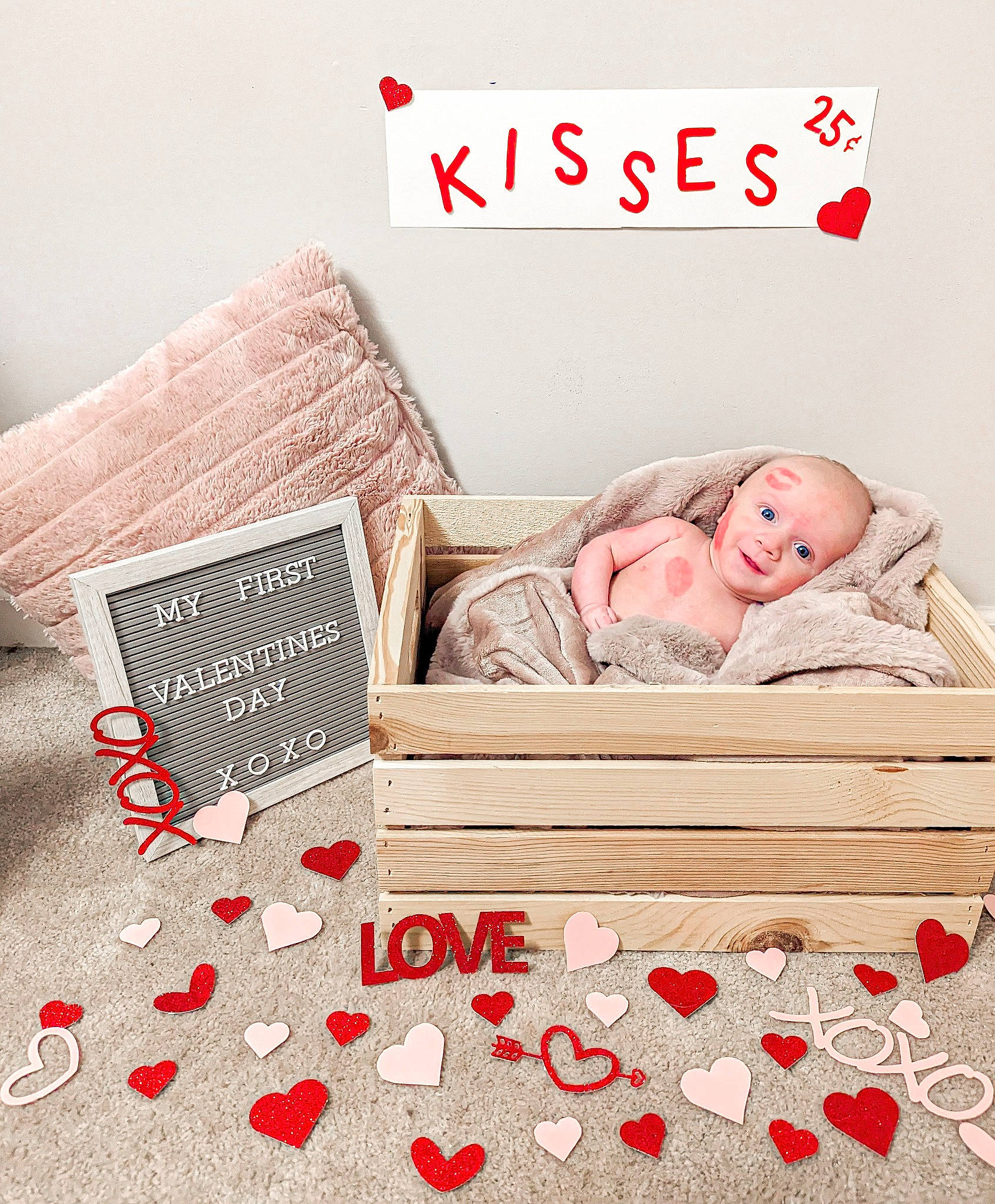 Holden is registered to the contest to win money with this photo: baby, bedding, carmine, comfort, event, flooring, font, gambling, happy, hardwood, linens, pattern, person, product, publication, rectangle, red, room, table, textile