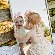 Lucy joined the competition — help win amazing prizes! accessories, baby, blonde, bonnet, clothing, dress, face, grass, hat, head, jewelry, mirror, necklace, person, photoframe, photography, plant, portrait, skirt, wood