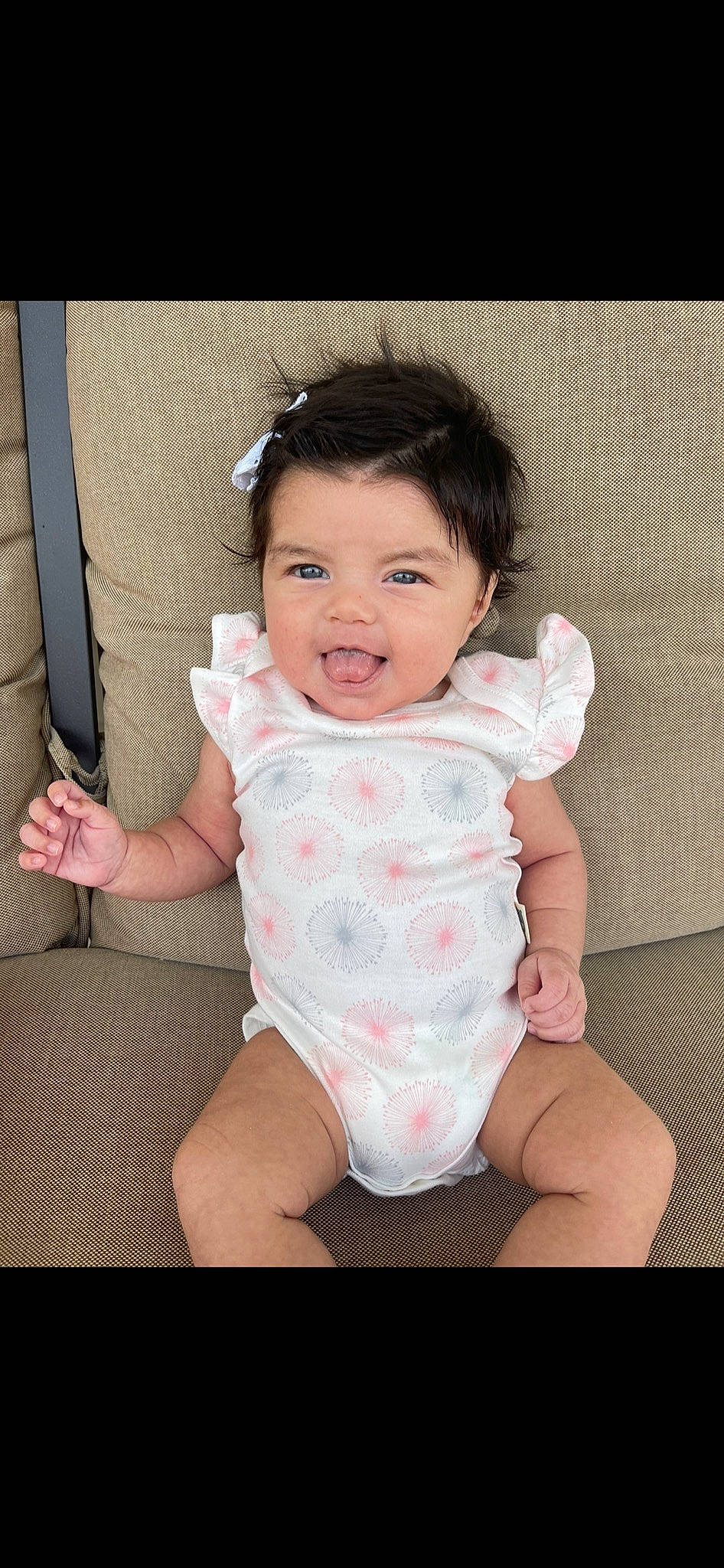 Sophia is registered to the contest to win money with this photo: baby, baby_toddler_clothing, cheek, collar, dress, flash_photography, gesture, hair, hand, happy, iris, lip, neck, person, pink, product, skin, sleeve, smile, thumb