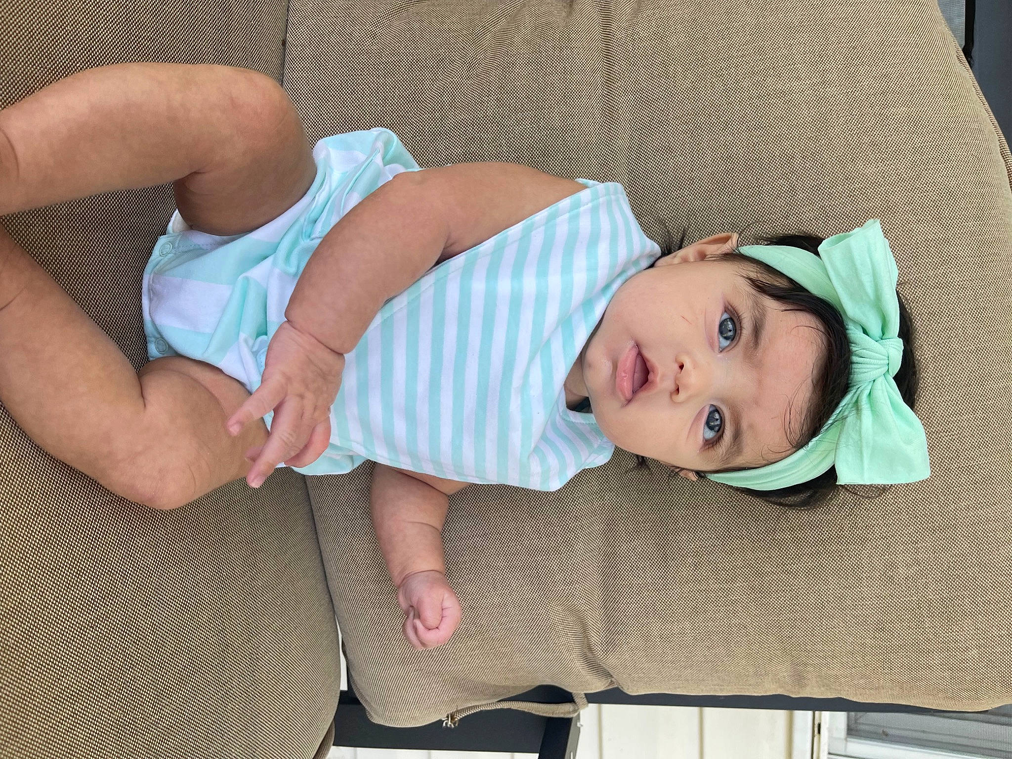 Sophia is registered to the contest to win money with this photo: baby, baby_products, baby_toddler_clothing, chest, child, comfort, elbow, foot, headwear, human_body, human_leg, joint, knee, pattern, person, sitting, skin, sleeve, textile, thigh