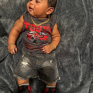 Sulenny joined the competition — help win amazing prizes! baby, child, infant, blanket, gray_blanket, clothing, tank_top, graphic_tshirt, ripped_shorts, denim_shorts, sneakers, nike, jewelry, gold_chain, bracelet, ring, footwear, cute, indoors, portrait