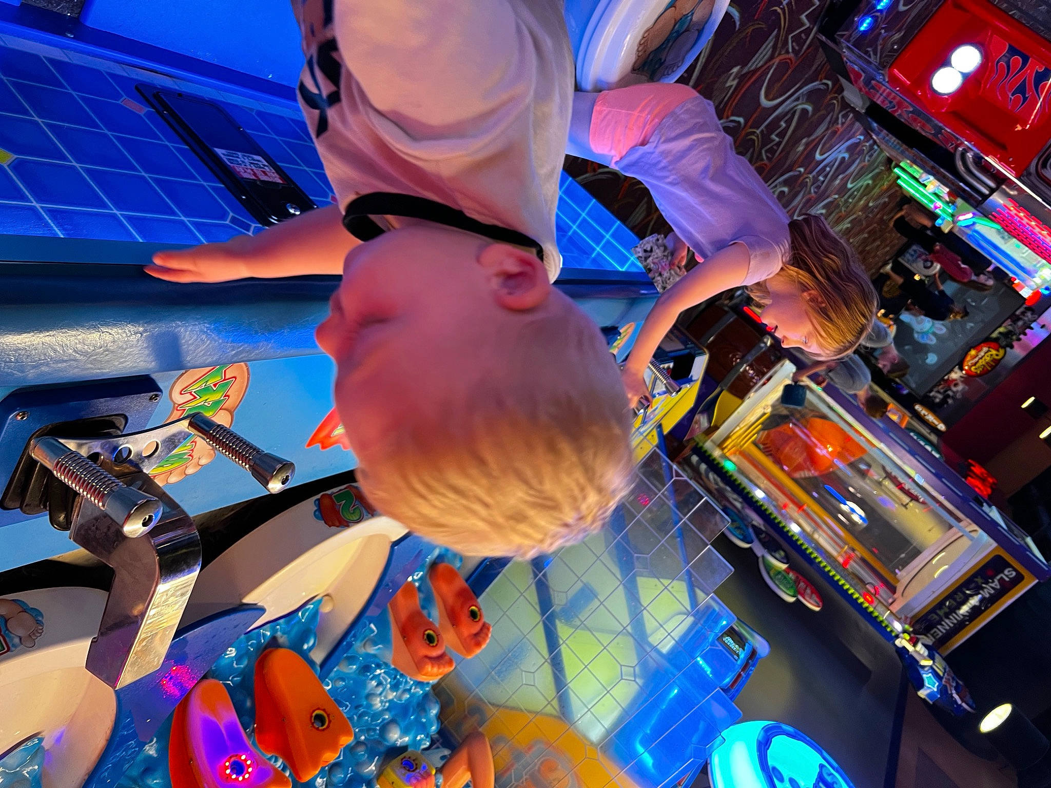 Jon is registered to the contest to win money with this photo: amusement_park, amusement_ride, blue, electric_blue, entertainment, event, fun, games, indoor_games_and_sports, leisure, machine, magenta, microphone, musician, party, person, public_event, recreation, room, technology