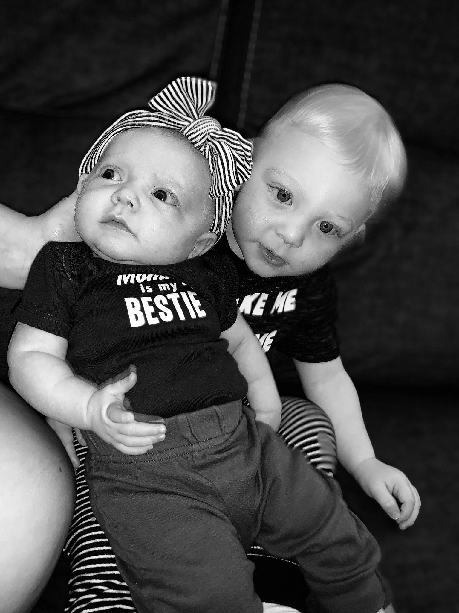 Jon is registered to the contest to win money with this photo: arm, baby, baby_toddler_clothing, black_and_white, cheek, eye, flash_photography, gesture, happy, headwear, human, human_body, iris, leg, monochrome, monochrome_photography, person, skin, smile, standing