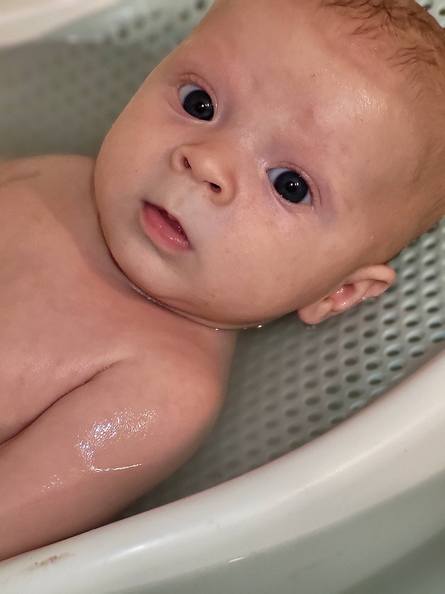 Landon is registered to the contest to win money with this photo: baby, baby_bathing, baby_products, bathing, bathroom, bathtub, cheek, chest, child, circle, close_up, eyelash, fluid, foam, iris, lip, nose, person, plumbing_fixture, skin