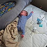 baby, mattress, blanket, pajamas, pacifier, bottle, nursing_pillow, sleeping, infant, bedroom, rest, child, baby_bottle, soft_toy, comfort, newborn, indoor, baby_sleep, baby_essentials, relaxation