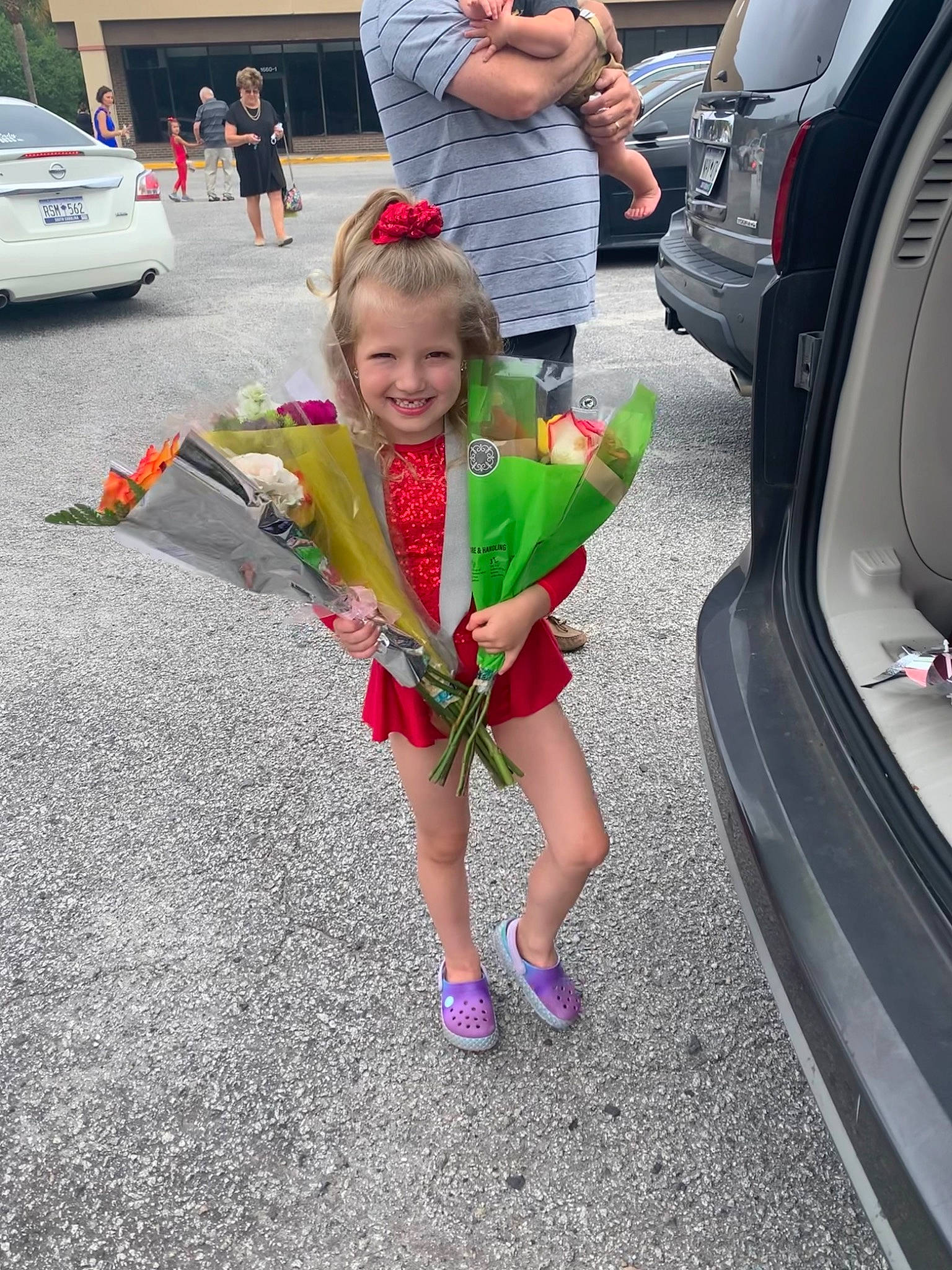 Ashtyn joined the competition — help win amazing prizes! asphalt, automotive_design, automotive_tire, automotive_wheel_system, bumper, car, clothing, dress, joy, leisure, motor_vehicle, person, plant, road, shorts, sneakers, tire, toy, trunk, vehicle