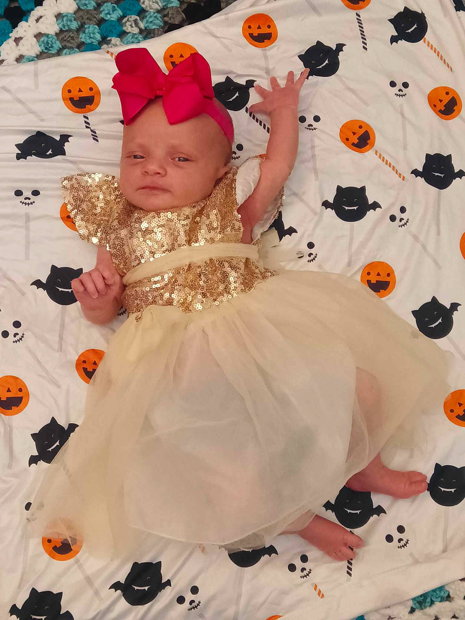 Brooklyn is registered to the contest to win money with this photo: art, baby, baby_toddler_clothing, child, costume, costume_hat, dress, entertainment, event, fashion_design, fun, happy, hat, headpiece, party_supply, pattern, peach, person, pink, textile