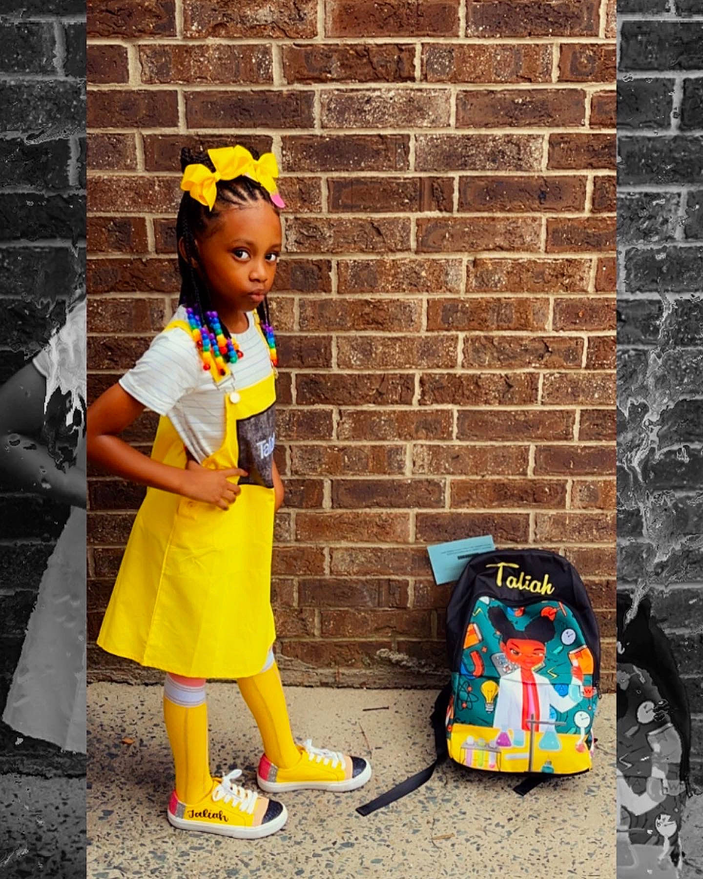 Taliah is registered to the contest to win money with this photo: asphalt, bag, brick, brickwork, child, door, electric_blue, eyewear, fun, happy, orange, person, road, sandal, sidewalk, sitting, street, t_shirt, toddler, visual_arts