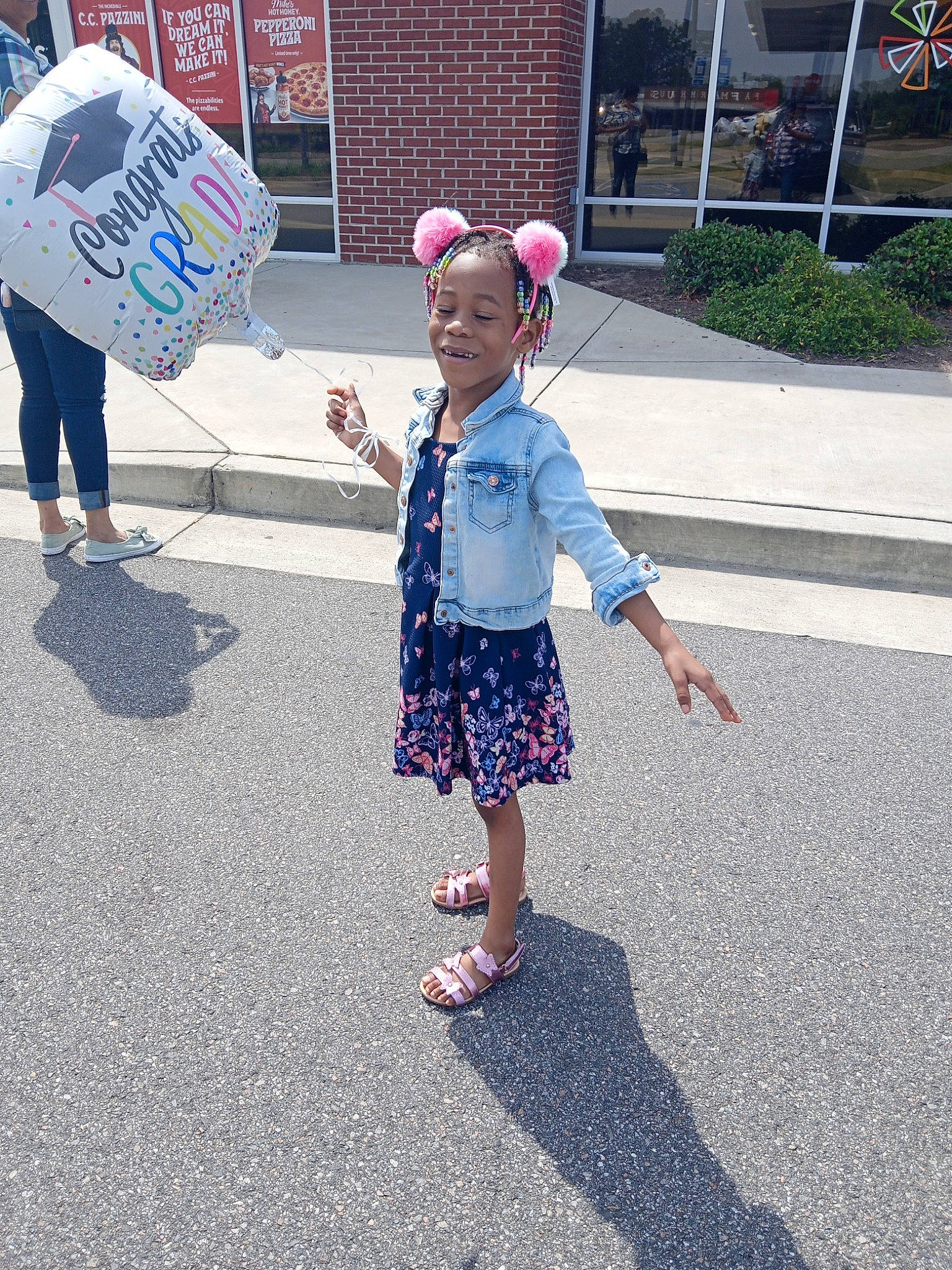Aaliyah Bullard is registered to the contest to win money with this photo: asphalt, child, city, electric_blue, fun, gesture, happy, joy, leisure, pedestrian, person, pink, plant, recreation, road, road_surface, sidewalk, smile, street, tar
