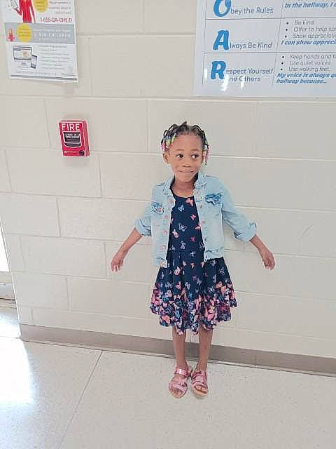 Aaliyah Bullard joined the competition — help win amazing prizes! baby_toddler_clothing, child, day_dress, denim, dress, electric_blue, fashion_design, flooring, font, fun, gesture, happy, human_leg, joy, one_piece_garment, pattern, person, room, sleeve, standing