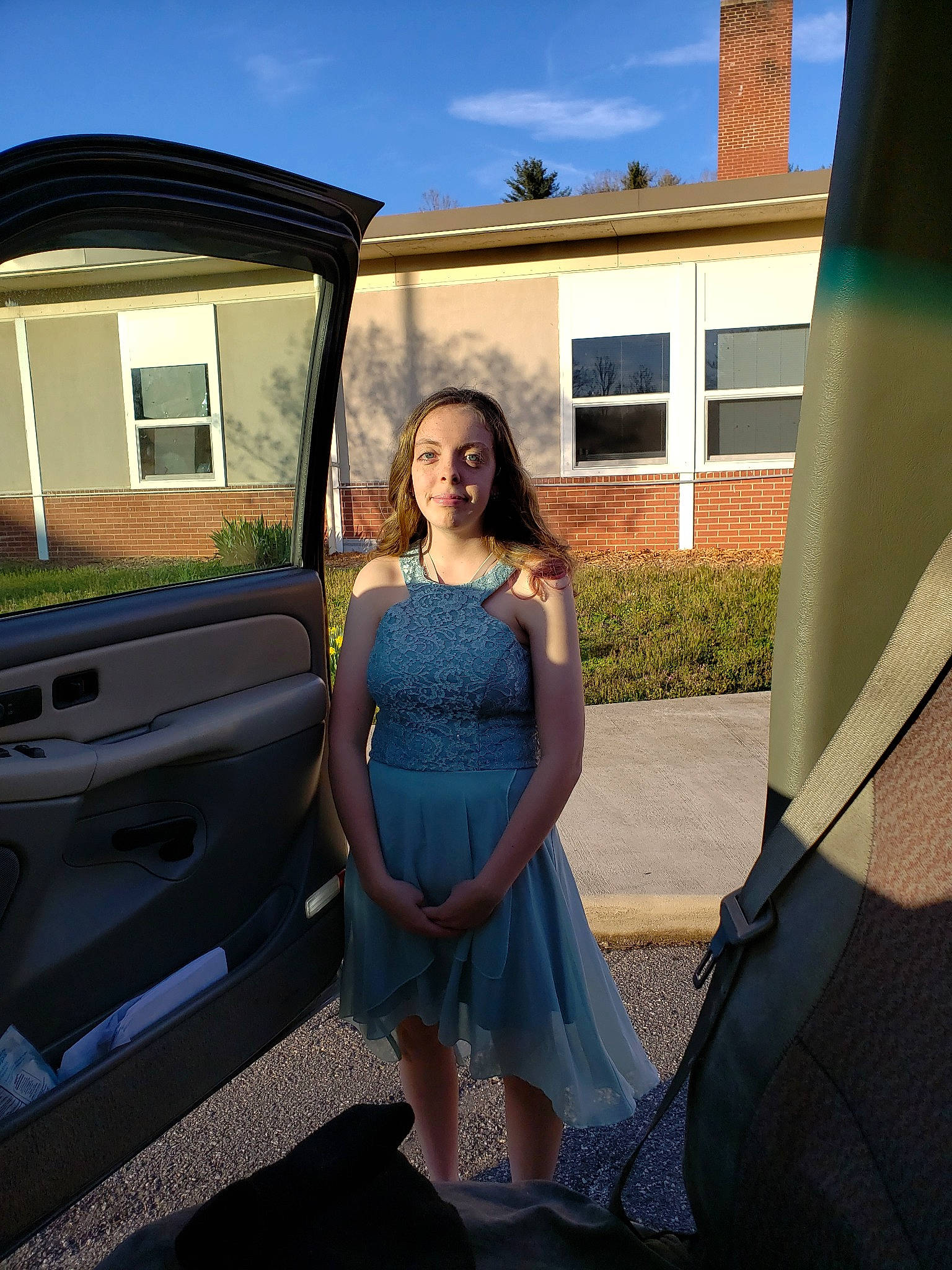 Brett is registered to the contest to win money with this photo: car, dress, family_car, fun, grass, leg, long_hair, luxury_vehicle, person, photo_shoot, photography, plant, prom, summer, tree, vacation, vehicle, vehicle_door