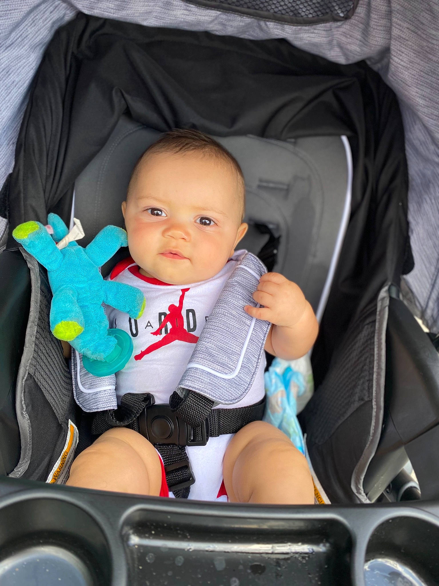 Creed is registered to the contest to win money with this photo: auto_part, baby, baby_carriage, baby_in_car_seat, baby_products, baby_safety, baby_toddler_clothing, bag, black, car_seat, chair, child, comfort, infant_bed, lap, nail, person, product, sitting, toddler
