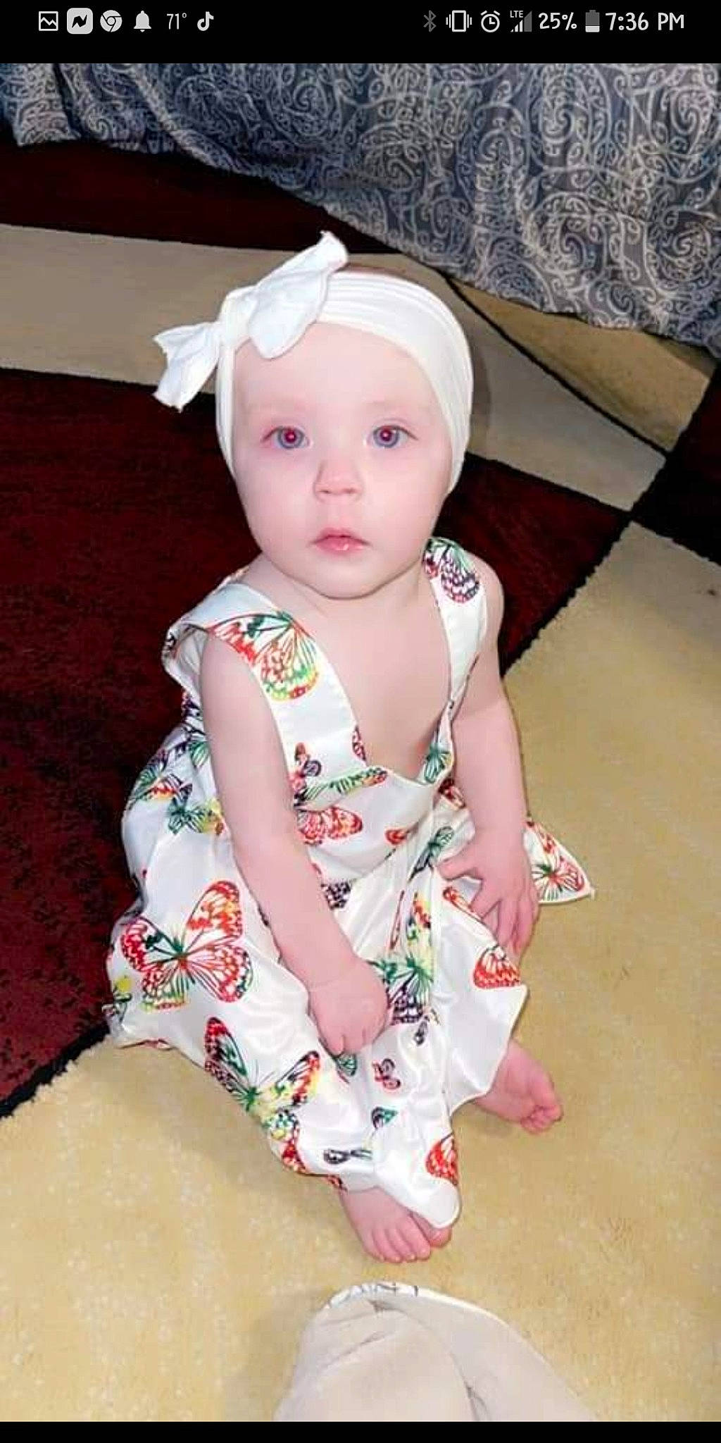 Emilee joined the competition — help win amazing prizes! baby, baby_toddler_clothing, cheek, collar, day_dress, dress, eye, eyelash, head, headwear, human_body, iris, lip, neck, one_piece_garment, pattern, person, pink, sitting, sleeve