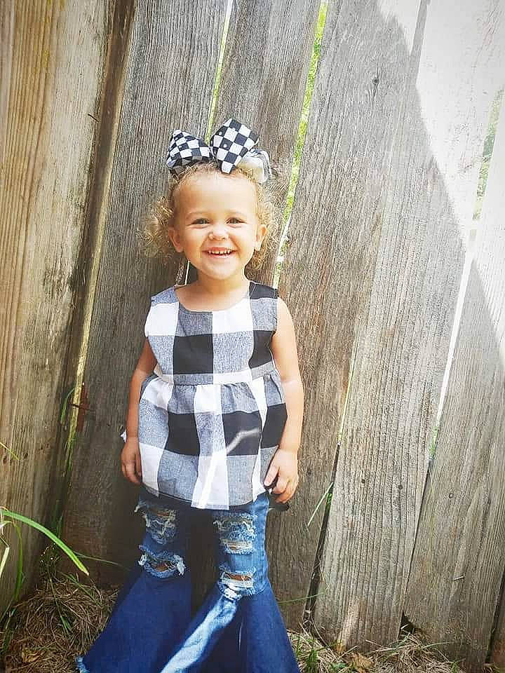 Trinity is registered to the contest to win money with this photo: baby_toddler_clothing, child, child_model, denim, design, fashion_accessory, hair_accessory, headgear, jeans, joy, pattern, person, photo_shoot, photography, plant, smile, toddler