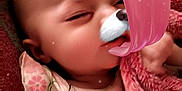Becky joined the competition — help win amazing prizes! baby, sleeping, blanket, floral, face_filter, dog_filter, ears, tongue, nose, infant, cute, child, soft_texture, pink, closeup, portrait, indoors, rest, peaceful, filter_effect