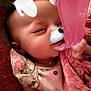 baby, sleeping, blanket, floral, face_filter, dog_filter, ears, tongue, nose, infant, cute, child, soft_texture, pink, closeup, portrait, indoors, rest, peaceful, filter_effect