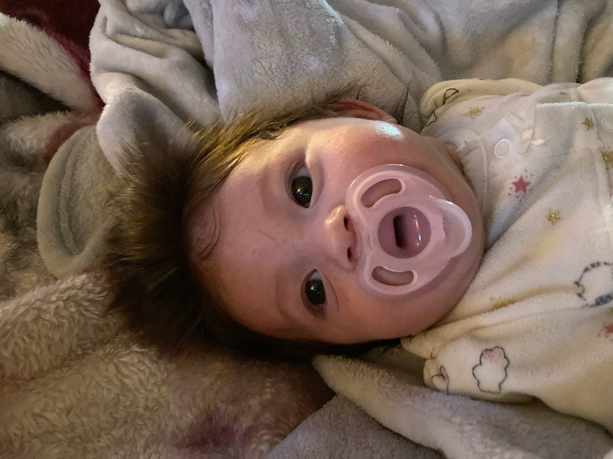 Yuevettee is registered to the contest to win money with this photo: cheek, close_up, comfort, eye, eyelash, face, happy, hat, head, human_body, iris, linens, lip, neck, nose, person, skin, snout, surprise, toddler