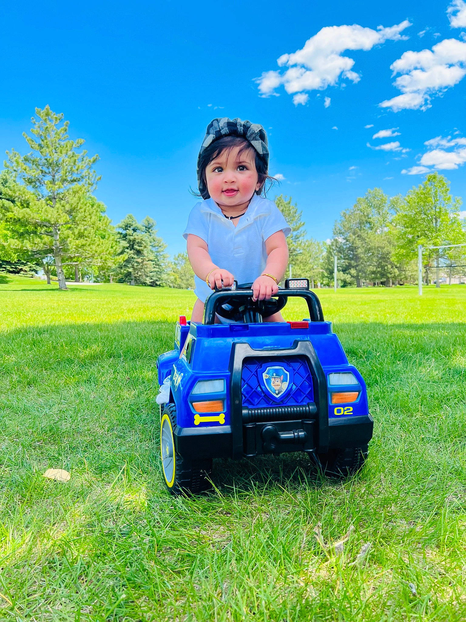 Laxmithanvika is registered to the contest to win money with this photo: automotive_design, automotive_exterior, automotive_tire, cloud, grass, grassland, green, happy, headwear, jeans, leisure, motor_vehicle, people_in_nature, person, plant, riding_toy, rolling, sky, tire, tree