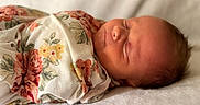 Kinsley is registered to the contest to win money with this photo: newborn, baby, sleeping, blanket, floral, wrapped, infant, soft, peaceful, portrait, closeup, face, skin, head, person, young, resting, cozy, indoor, cute