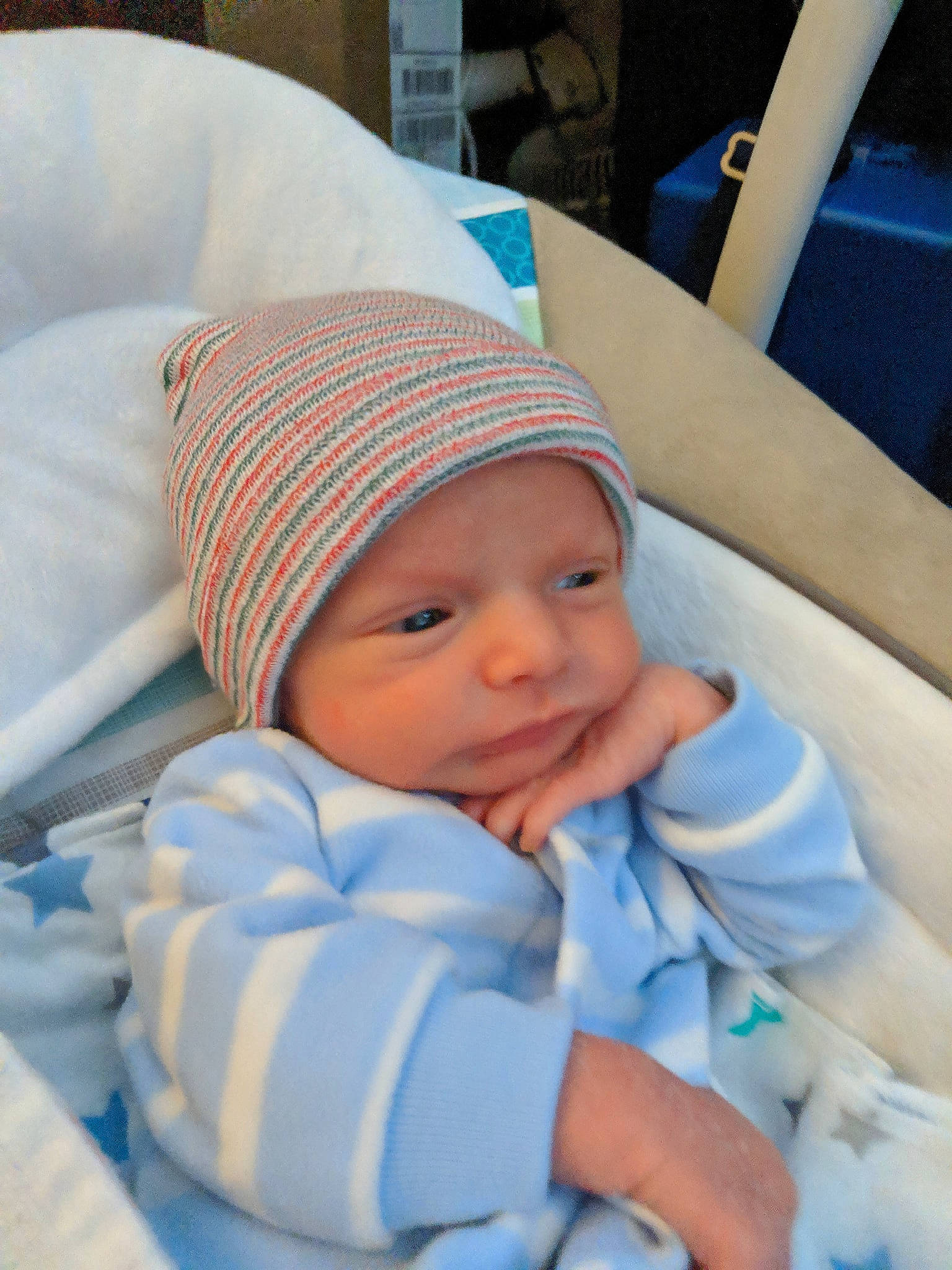 Bjørn is registered to the contest to win money with this photo: baby_products, blue, cap, cheek, child, day, ear, girl, head, headgear, headwear, infant, person, product, sitting, skin, sleep, toddler