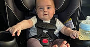 Cameron joined the competition — help win amazing prizes! baby, car_seat, infant, child, bottle, car_interior, seatbelt, foot, hand, clothing, window, outside, daylight, curious, strapped_in, sitting, safety, head, face, expression