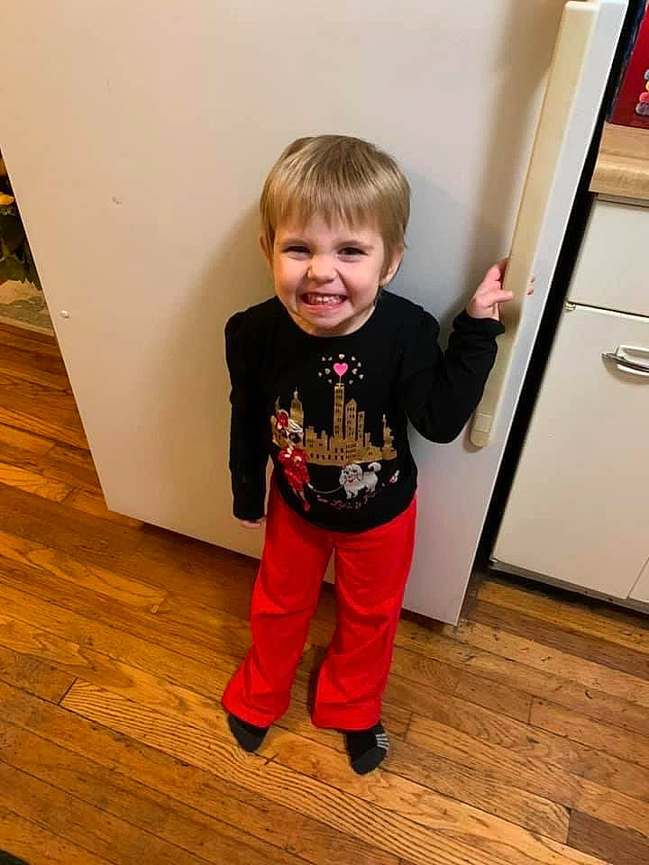 Honesty is registered to the contest to win money with this photo: active_pants, baby, baby_toddler_clothing, cabinetry, child, door, floor, flooring, hardwood, joy, laminate_flooring, person, shoe, sleeve, smile, standing, t_shirt, toddler, varnish, wood