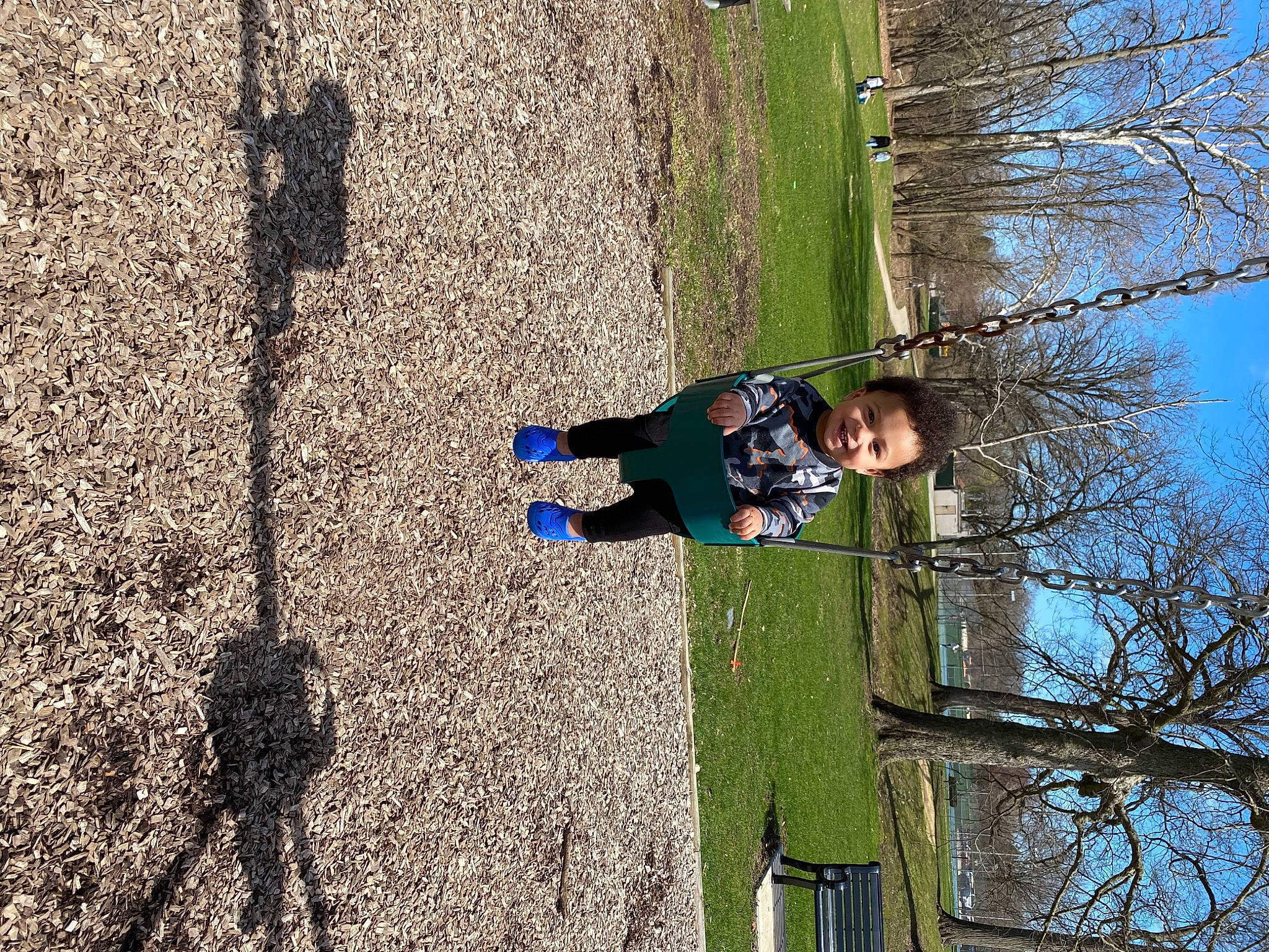 Malikye is registered to the contest to win money with this photo: adventure, branch, fun, grass, joy, landscape, leisure, people_in_nature, person, plant, recreation, shadow, sky, slope, soil, tints_and_shades, toddler, tree, trunk, twig