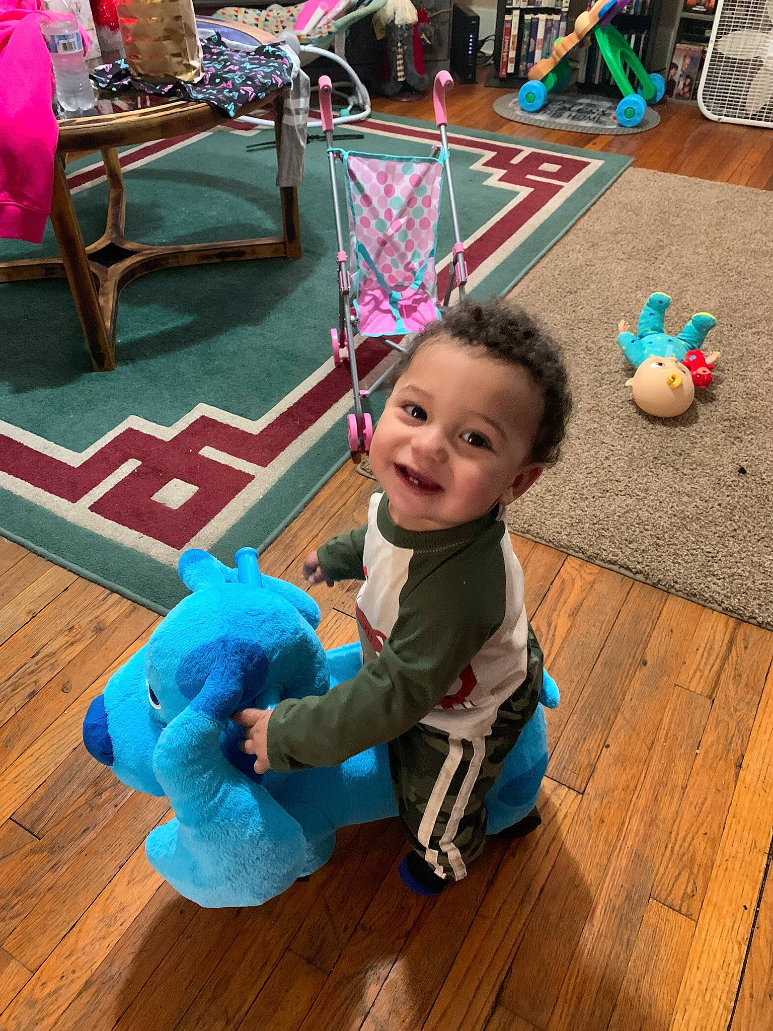 Malikye joined the competition — help win amazing prizes! baby_toddler_clothing, blue, child, floor, flooring, fun, green, happy, hardwood, human, joy, leisure, people, person, product, purple, smile, standing, toddler, toy