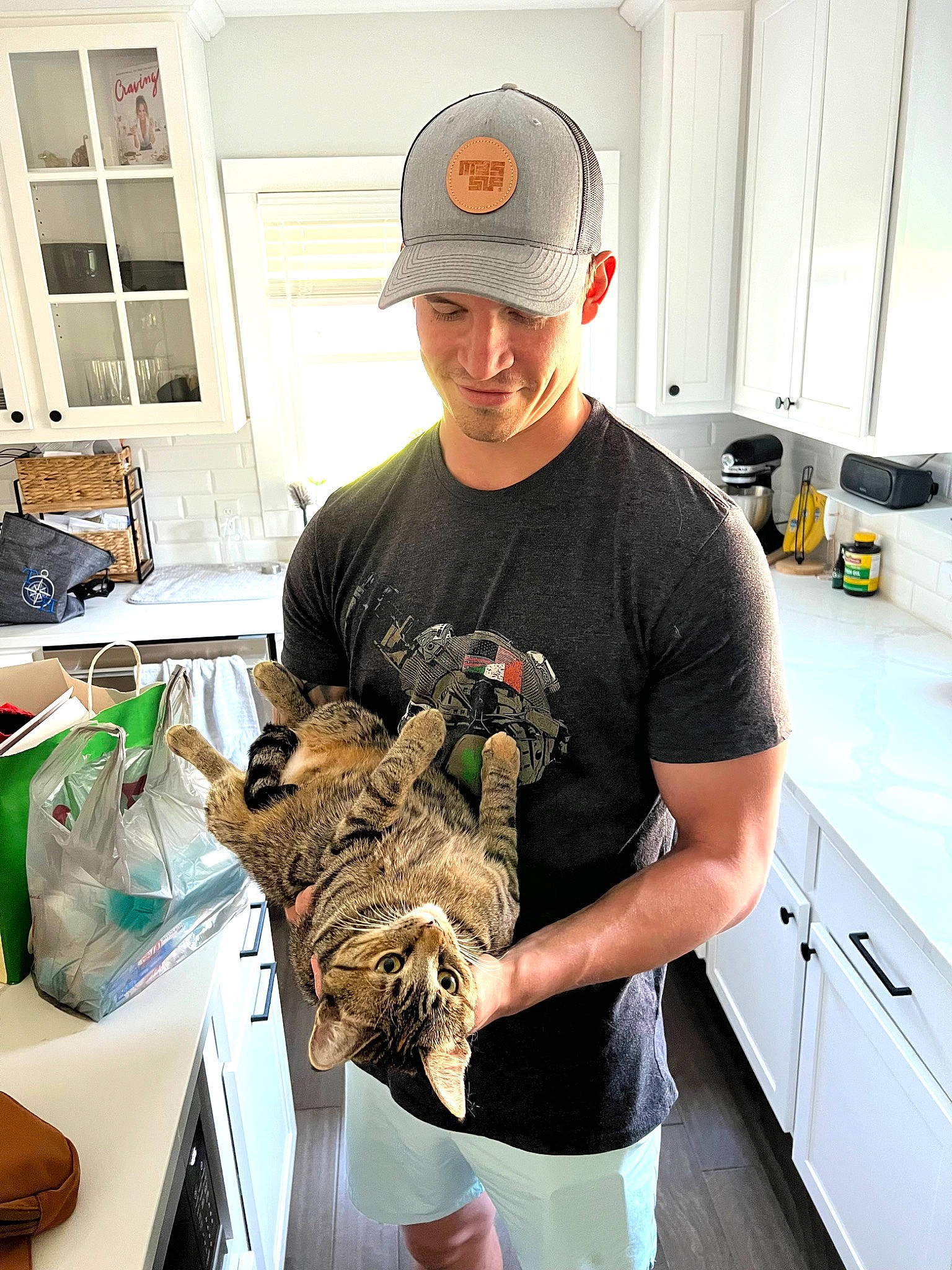 Lua joined the competition — help win amazing prizes! baseball_cap, cabinetry, cap, comfort_food, cooking, engineering, eyewear, fashion_design, fur, glove, hat, job, kitchen, machine, room, safety_glove, sleeve, t_shirt, table, wildlife_biologist