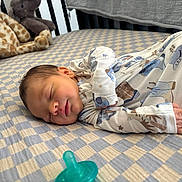 Grayson joined the competition — help win amazing prizes! newborn, baby, sleeping, onesie, cowboy_theme, blanket, checkered, pacifier, plush_toys, giraffe_toy, nursery, crib, soft, cute, infant, peaceful, child, indoors, portrait, resting