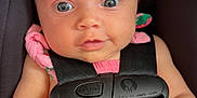 Celine joined the competition — help win amazing prizes! baby, infant, car_seat, harness, pink_clothing, child, face, eyes, hands, seatbelt, straps, safety, cute, portrait, indoor, closeup, person, expression, child_seat, young